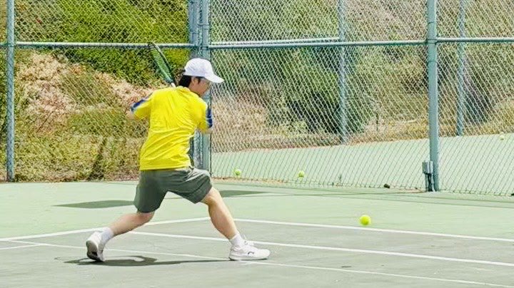 Hitting a backhand on the tennis court